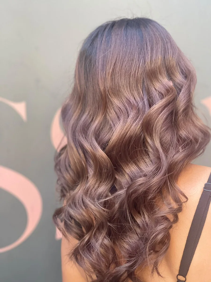 Long brunette hair styled in soft waves