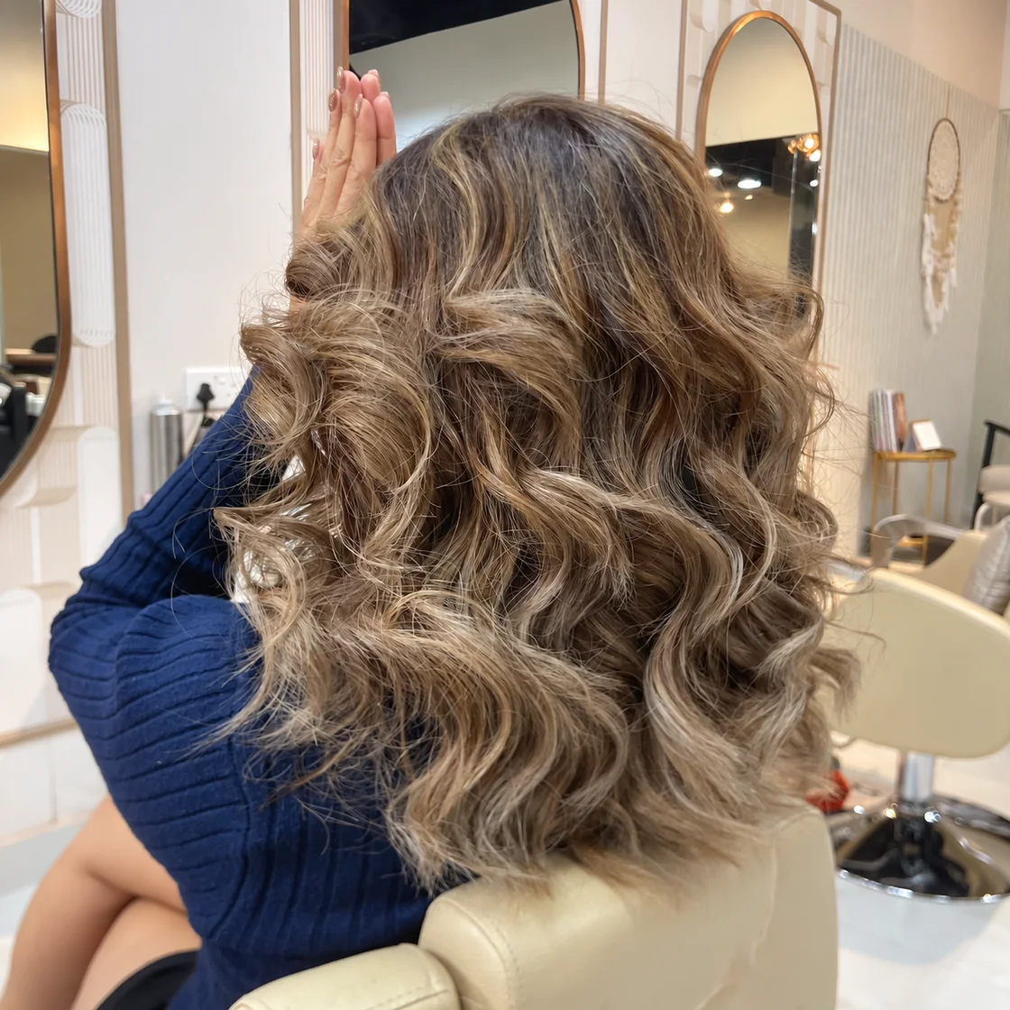 Voluminous curls on ash-blonde hair